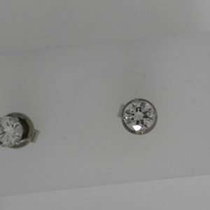 Estate Diamond Earrings 
14 Karat White Estate Diamond Earrings 
 
2 Center Diamonds 0.36ct Shape: Round; Clarity: SI2; Colour: J/K 0.73