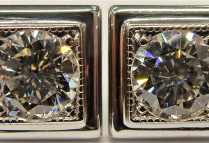 Estate Diamond Earrings 
14 Karat White Estate Diamond Earrings 
Gram Weight 2.81 
2 Center Diamonds 0.56ct Shape: Round; Clarity: SI1; Colour: G/H 1.12