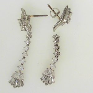 Estate Diamond Earrings 
14K/Platinum White Estate Diamond Earrings 
Gram Weight 6.7 
26 Center Diamonds Shape: Round; Clarity: VS; Colour: G/H With 10 Baguette Diamonds 0.70 ctw and 10 Various Shapes Diamonds 1.75 ctw 3.6