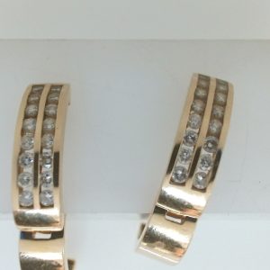 Estate Diamond Earrings 
14 Karat Yellow Estate Diamond Earrings 
Gram Weight 7.5 
32 Center Diamonds Shape: Round; Clarity: I1; Colour: I/J 1