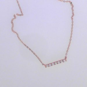 Diamond Pendant/Necklace 
14 Karat Rosé Diamond Pendant 
Gram Weight 0.96 Chain Style: Cable Link 14 Karat Rosé Length: 18in 
7 Center Diamonds Shape: Round 0.1