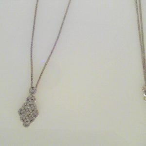 Diamond Pendant/Necklace 
10 Karat White Diamond Pendant 
Gram Weight 3.4 Chain Style: Wheat 14 Karat White Length: 18in 
 Center Diamond Shape: Round 0.5