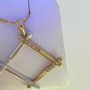 Diamond Pendant/Necklace 
10 Karat Yellow/White Diamond Pendant 
Gram Weight 6.2 Chain Style: Figaro 10 Karat Yellow Length: 18in 
20 Center Diamonds Shape: Round 0.2