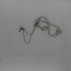 Estate Diamond Pendant/Necklace 
10 Karat White Estate Diamond Pendant 
Gram Weight 1 Chain Style: Curb 10 Karat White 18 
7 Center Diamonds Shape: Round