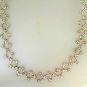 Estate Diamond Pendant/Necklace 
14 Karat White Estate Diamond Pendant 
Gram Weight 25.8 Chain Style: Fancy Link 14 Karat White 17 
75 Center Diamonds Shape: Round 1