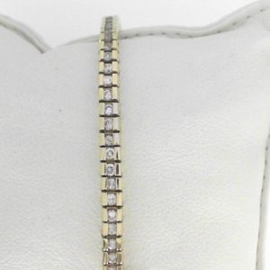 Estate Diamond Bracelet 
14 Karat Yellow Estate Diamond Bracelet Length: 7in 
Gram Weight 18.5 
73 Center Diamonds Shape: Round; Clarity: I1; Colour: I/J 3