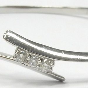 Estate Diamond Bracelet 
10 Karat White Estate Diamond Bracelet Width: 2.5mm 
Gram Weight 9.1 
3 Center Diamonds Shape: Round; Clarity: I1; Colour: J 0.12