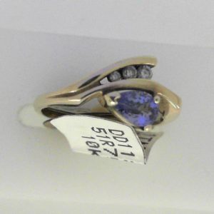 Diamonds Ring 
10 Karat Yellow Diamonds Ring With Finger Size 6.25 
Width 1.7mm Gram Weight 2.73 
3 Center Diamonds Shape: Round With 1 Pear Tanzanite and 1 Pear Tourmaline