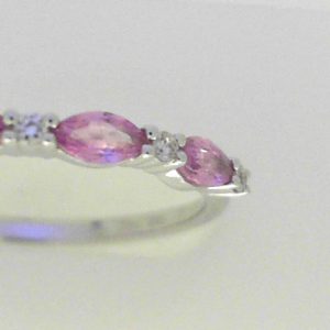 Sapphires Ring 
14 Karat White Pink Sapphires Ring With Finger Size 10.5 
Width 1.89mm 
3 Center Sapphires Shape: Marquise; Colour: Pink With 4 Round Diamonds