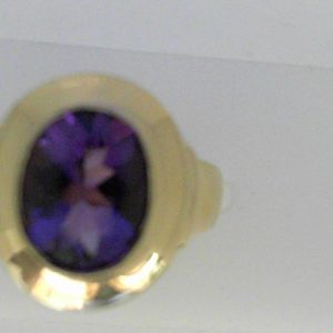 Amethyst Ring 
14 Karat Yellow Amethyst Ring With Finger Size 6 
Width 3.05mm Gram Weight 7.83 
1 Center Amethyst Shape: Oval