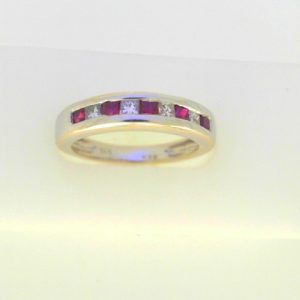 Rubies Ring 
14 Karat White Rubies Ring With Finger Size 6.5 
Width 3mm Gram Weight 3.96 
5 Center Rubies Shape: Princess With 4 Princess Diamonds 0.37 ctw