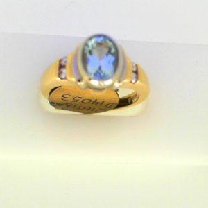 Aqua Ring 
14 Karat Yellow/White Aqua Ring With Finger Size 6.5 
Width 2.45mm Gram Weight 5.56 
1 Center Aqua Shape: Oval With 4 Round Diamonds 0.08 ctw