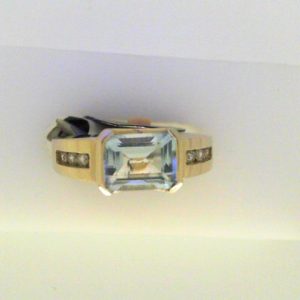 Aqua Ring 
14 Karat White Aqua Ring With Finger Size 6 
Width 3.2mm Gram Weight 5.31 
1 Center Aqua Shape: Emerald With 6 Round Diamonds 0.12 ctw