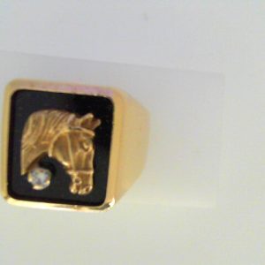 Diamond Ring 
10 Karat Yellow Diamond Ring With Finger Size 10 
 
1 Center Diamond 0.04ct Shape: Round With 1 Various Shapes Onyx