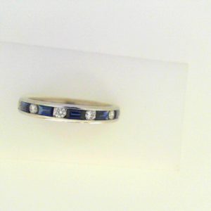 Diamonds Ring 
14 Karat White Diamonds Ring With Finger Size 6.75 
 
6 Center Diamonds Shape: Round With 5 Baguette Sapphires