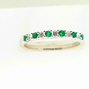 Emeralds Ring 
18 Karat White Emeralds Ring With Finger Size 7 
 
6 Center Emeralds Shape: Round With 5 Round Diamonds 0.11 ctw