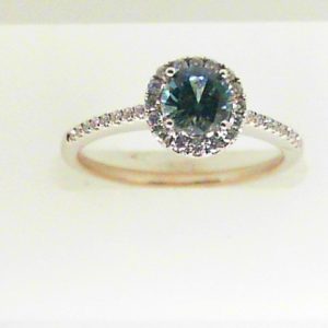 Sapphire Ring 
14 Karat White Greenish Blue Sapphire Ring With Finger Size 6.5 
 
 Center Sapphire Shape: Round; Colour: Greenish Blue Round Diamond 0.13 ctw