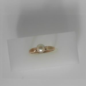 Pearl Ring 
10 Karat Yellow Pink Pearl Ring With Finger Size 7 
 Gram Weight 2.01 
1 Center Pearl Shape: Round; Colour: Pink