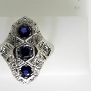 Sapphires Ring 
14 Karat White Blue Sapphires Ring With Finger Size 6.75 
 
3 Center Sapphires Shape: Round; Colour: Blue With 14 Round Diamonds 0.17 ctw