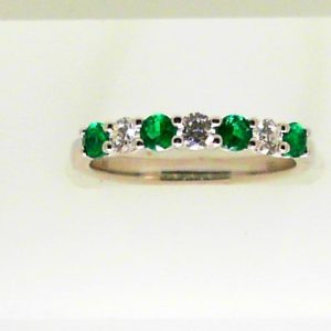 Emeralds Ring 
18 Karat White Emeralds Ring With Finger Size 6.5 
 
4 Center Emeralds Shape: Round With 3 Round Diamonds 0.24 ctw