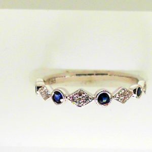 Sapphires Ring 
18 Karat White Blue Sapphires Ring With Finger Size 6.5 
 
4 Center Sapphires Shape: Round; Colour: Blue With 5 Round Diamonds 0.09 ctw