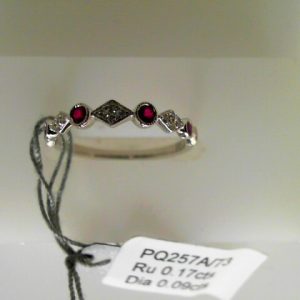 Rubies Ring 
18 Karat White Rubies Ring With Finger Size 6.5 
 
4 Center Rubies Shape: Round With 4 Round Diamonds 0.09 ctw