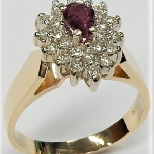 Ruby Estate Ring
14 Karat Yellow/White Ruby Ring With Finger Size 8
Width 2.75mm Gram Weight 5.65
1 Center Ruby 0.42ct Shape: Pear With 25 Round Diamonds 0.45 ctw