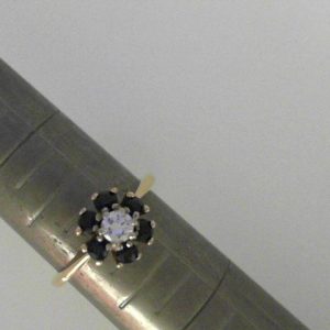 Sapphires Estate Ring 
14 Karat Yellow Sapphires Ring With Finger Size 6 
Width 1.6mm Gram Weight 3.38 
6 Center Sapphires Shape: Round With 1 Round Diamond 0.17 ctw