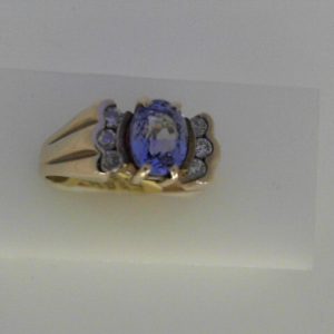 Sapphire Estate Ring 
10 Karat Yellow Sapphire Ring With Finger Size 10 
Width 2.86mm Gram Weight 5.06 
1 Center Sapphire 1.68ct Shape: Oval With 6 Round Diamonds 0.25 ctw