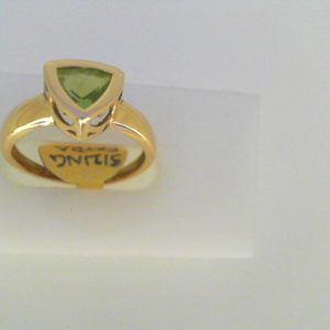 Peridot Estate Ring 
14 Karat Yellow Peridot Ring With Finger Size 7.25 
Width 1.7mm Gram Weight 2.7 
1 Center Peridot Shape: Trillian