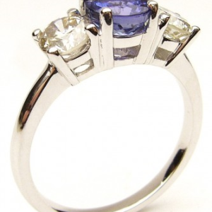 Tanzanite Estate Ring 
18 Karat White Tanzanite Ring With Finger Size 6.75 
 Gram Weight 3.3 
1 Center Tanzanite 1.01ct Shape: Round With 2 Round Diamonds 0.96 ctw