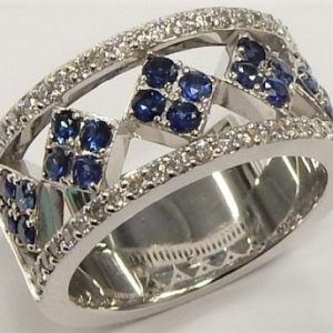 Sapphires Estate Ring 
14 Karat White Blue Sapphires Ring With Finger Size 6.5 
 Gram Weight 11.2 
20 Center Sapphires Shape: Round; Colour: Blue With 46 Round Diamonds 0.34 ctw