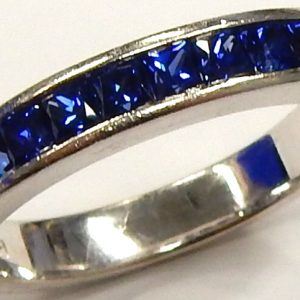 Lab-Grown Sapphire Estate Ring 
14 Karat White Sapphires Ring With Finger Size 6.75 
Width 3.6mm Gram Weight 3.68 
15 Center Sapphires Shape: Princess