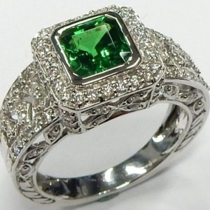 Tsavorite Garnet Estate Ring 
18 Karat White Green Tsavorite Garnet Ring With Finger Size 8.75 
 Gram Weight 7.87 
1 Center Tsavorite Garnet 2.00ct Shape: Square Cushion; Colour: Green With 108 Round Diamonds 1.00 ctw