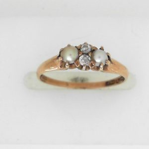 Pearls Estate Ring 
14 Karat Yellow Pearls Ring With Finger Size 5 
 Gram Weight 1.55 
2 Center Pearls Shape: Round With 2 Round Diamonds 0.20 ctw