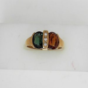 Tourmaline Estate Ring 
14 Karat Yellow Greenish Blue Tourmaline Ring With Finger Size 7.5 
 Gram Weight 3.34 
1 Center Tourmaline 0.97ct Shape: Oval; Colour: Greenish Blue With 1 Oval Citrine 1.23 ctw and 3 Round Diamonds 0.03 ctw