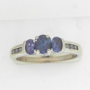 Tanzanites Estate Ring 
14 Karat White Tanzanites Ring With Finger Size 8 
 Gram Weight 3.47 
3 Center Tanzanites Shape: Oval With 6 Round Diamonds