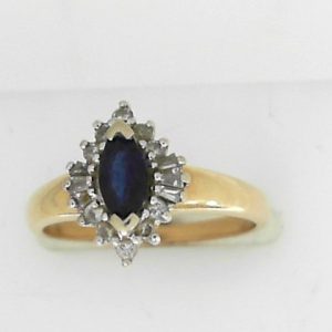 Sapphire Estate Ring 
14 Karat Yellow Sapphire Ring With Finger Size 7.5 
 Gram Weight 3.07 
1 Center Sapphire Shape: Marquise With 16 Various Shapes Diamonds