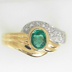 Emerald Estate Ring 
14 Karat Yellow Emerald Ring With Finger Size 7 
 Gram Weight 3.8 
1 Center Emerald Shape: Oval With 12 Round Diamonds 0.12 ctw