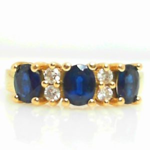 Sapphires Estate Ring 
14 Karat Yellow Blue Sapphires Ring With Finger Size 6.25 
 Gram Weight 3.9 
3 Center Sapphires Shape: Oval; Colour: Blue With 4 Round Diamonds 0.15 ctw