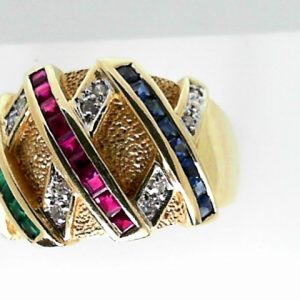 Rubies Estate Ring 
14 Karat Yellow Rubies Ring With Finger Size 8.25 
 Gram Weight 8.02 
9 Center Rubies Shape: Various Shapes With 8 Various Shapes Sapphires and 8 Various Shapes Emeralds and 12 Round Diamonds