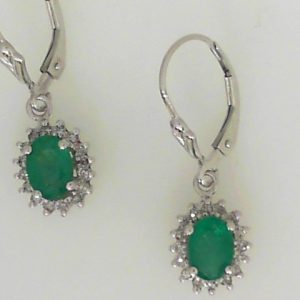 Earrings with Emeralds 
14 Karat White Emeralds Earrings 
 Gram Weight 3.3 
2 Center Emeralds Shape: Oval With 32 Round Diamonds