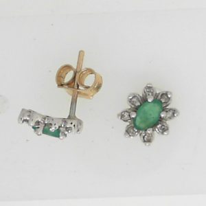 Estate Earrings With Emeralds 
10 Karat Yellow/White Emeralds Earrings 
 Gram Weight 1.15 
2 Center Emeralds Shape: Oval With 16 Round Diamonds