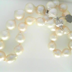Pearl Pendant 
 White Pearl Pendant 
 Chain Style: No Chain 14 Karat White Length: 18in 
 Center Pearl Shape: Baroque; Colour: White