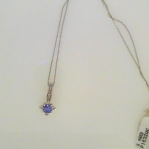 Tanzanite Pendant 
14 Karat White Tanzanite Pendant 
 Chain Style: Curb 14 Karat White Length: 18in 
1 Center Tanzanite Shape: Princess With 9 Round Diamonds