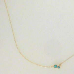 Turquoises Pendant 
14 Karat Yellow Turquoises Pendant 
 Chain Style: Cable Link 14 Karat Yellow Length: 16in 
2 Center Turquoises Shape: Round With 1 Round Sapphire