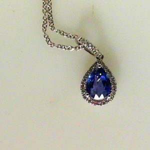 Sapphire Pendant 
18 Karat White Blue Sapphire Pendant 
 
1 Center Sapphire 0.85ct Shape: Pear; Colour: Blue With 22 Round Diamonds 0.11 ctw