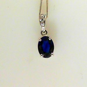 Sapphire Pendant 
18 Karat White Blue Sapphire Pendant 
 
1 Center Sapphire 1.11ct Shape: Oval; Colour: Blue With 4 Round Diamonds 0.05 ctw