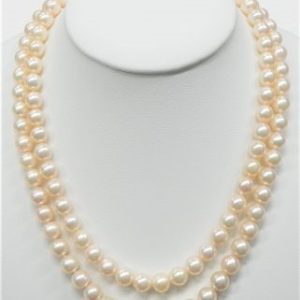 Pearl Estate Pendant 
14 Karat Yellow Pink Pearl Pendant 
 Chain Style: Pearl 14 Karat Yellow Length: 34in 
 Center Pearl Shape: Round; Colour: Pink