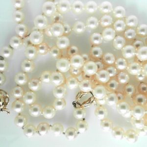 Pearls Estate Pendant 
14 Karat Yellow Pearls Pendant 
 Chain Style: No Chain Length: 36in 
120 Center Pearls 6.50ct Shape: Round